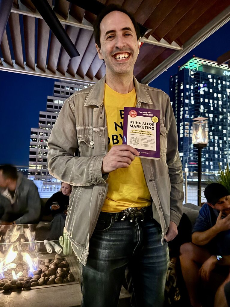 David Berkowitz holding The Non-Obvious Guide to Using AI for Marketing at SXSW 2025